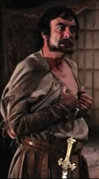 Richard Johnson as Cassius, baring his breast