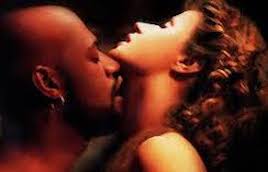 Othello kissing Desdemona's neck