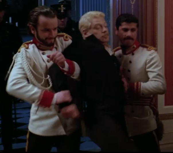 Hamlet dragged in by guards